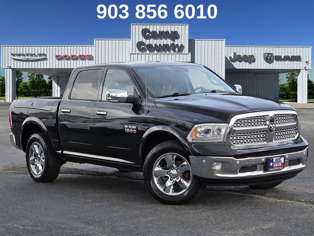 2017 RAM 1500 Laramie in Brilliant Black Crystal Pearlcoat — front three-quarter view