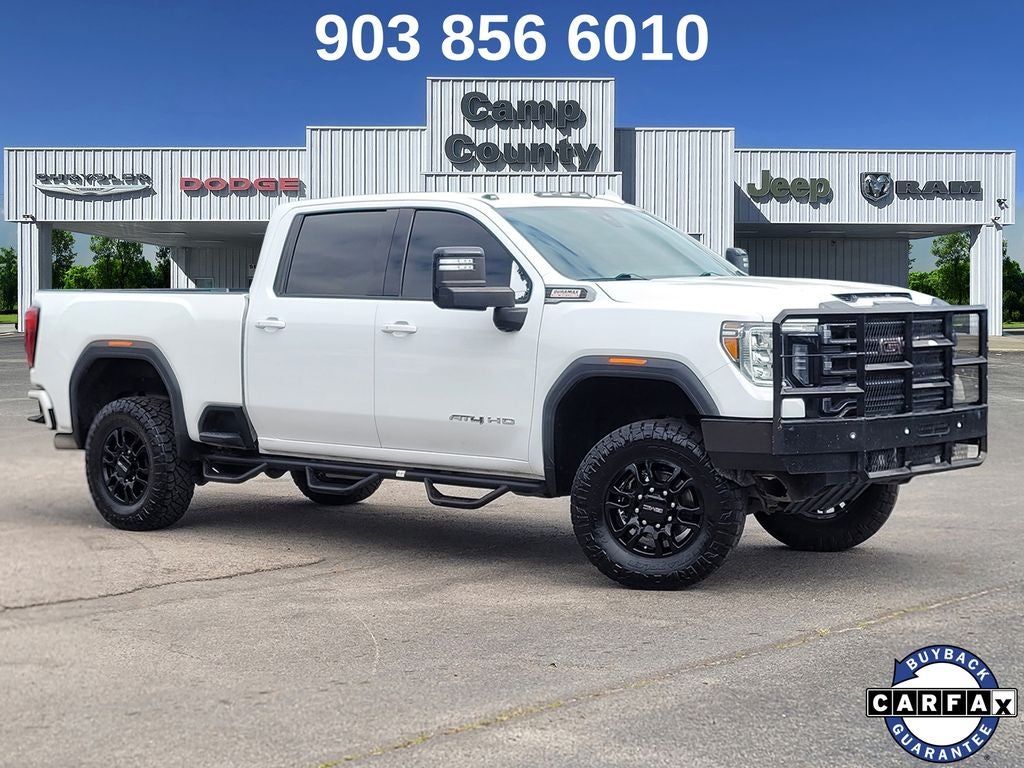 2021 GMC Sierra 2500HD AT4 in Summit White — front three-quarter view