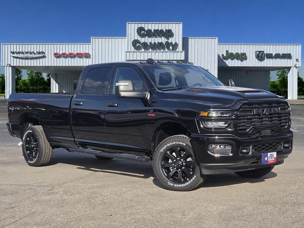 2026 RAM 2500 Tradesman in Diamond Black Crystal Pearlcoat — front three-quarter view