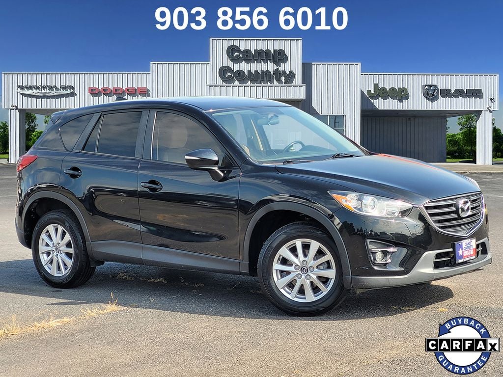 2016 Mazda Mazda CX-5 Touring in Jet Black Mica — front three-quarter view