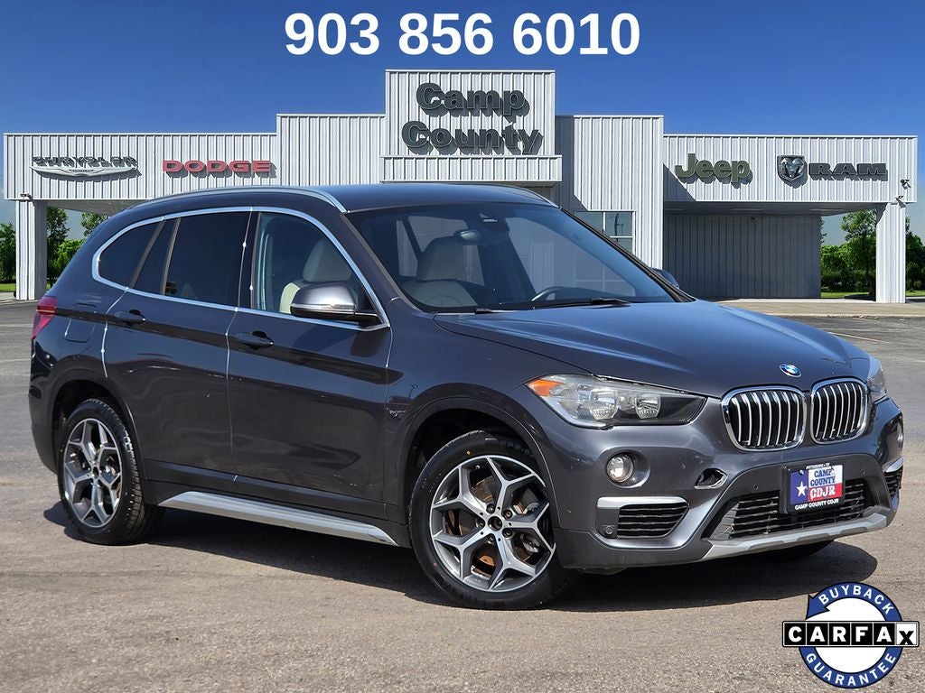 2019 BMW X1 sDrive28i in Mineral Grey Metallic — front three-quarter view